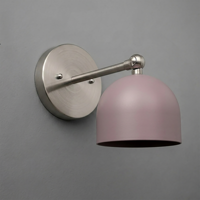 Wall-mounted sconce with brushed nickel arm and round base, featuring a matte pink dome-shaped shade. - SCONCE MODEL NO. 5103