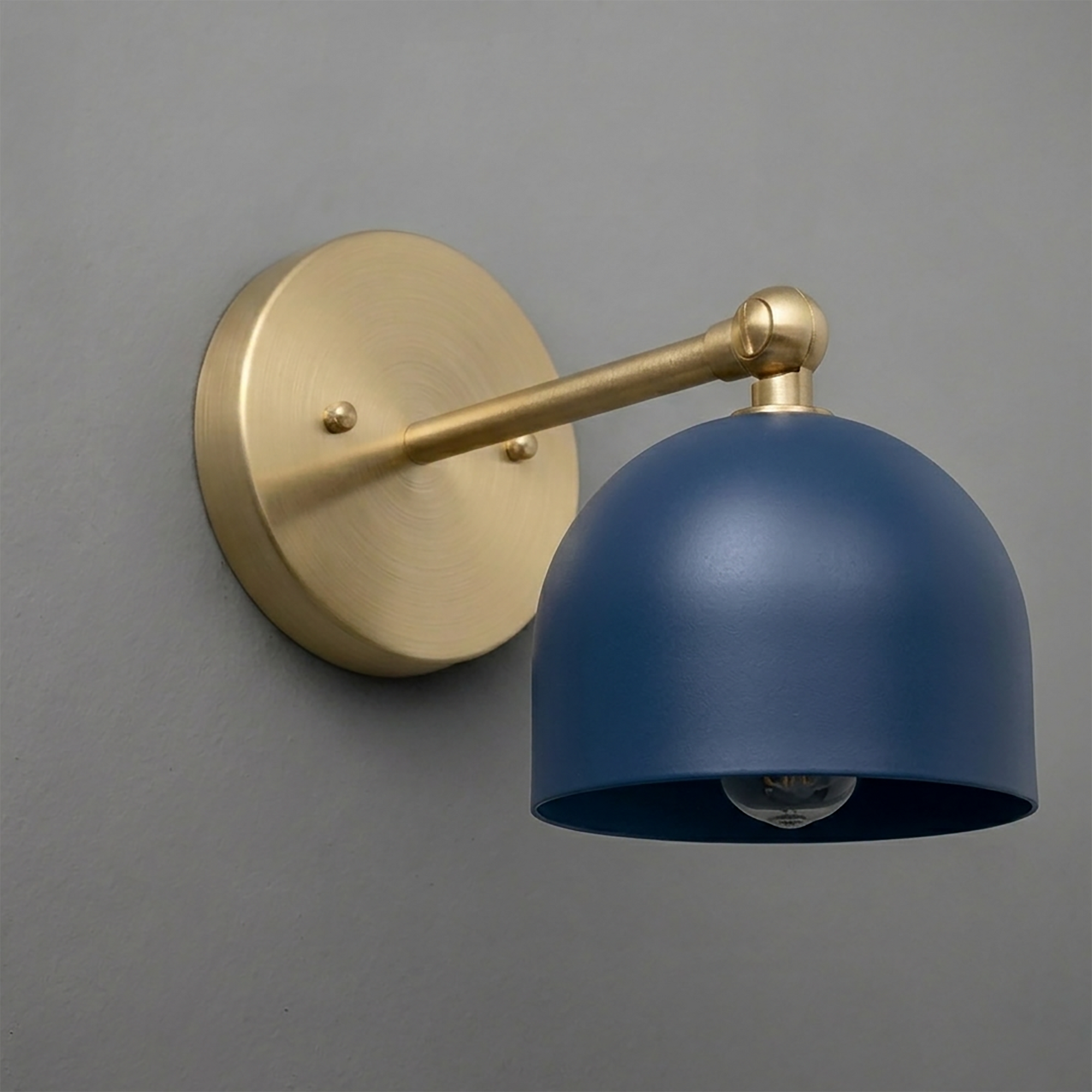 Wall-mounted sconce with a matte blue metal shade and brushed brass arm and base plate. - SCONCE MODEL NO. 5103