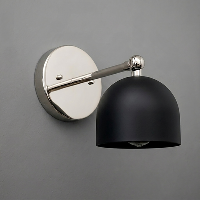 Wall-mounted sconce with a matte black dome-shaped shade and polished silver metal arm and base. - SCONCE MODEL NO. 5103