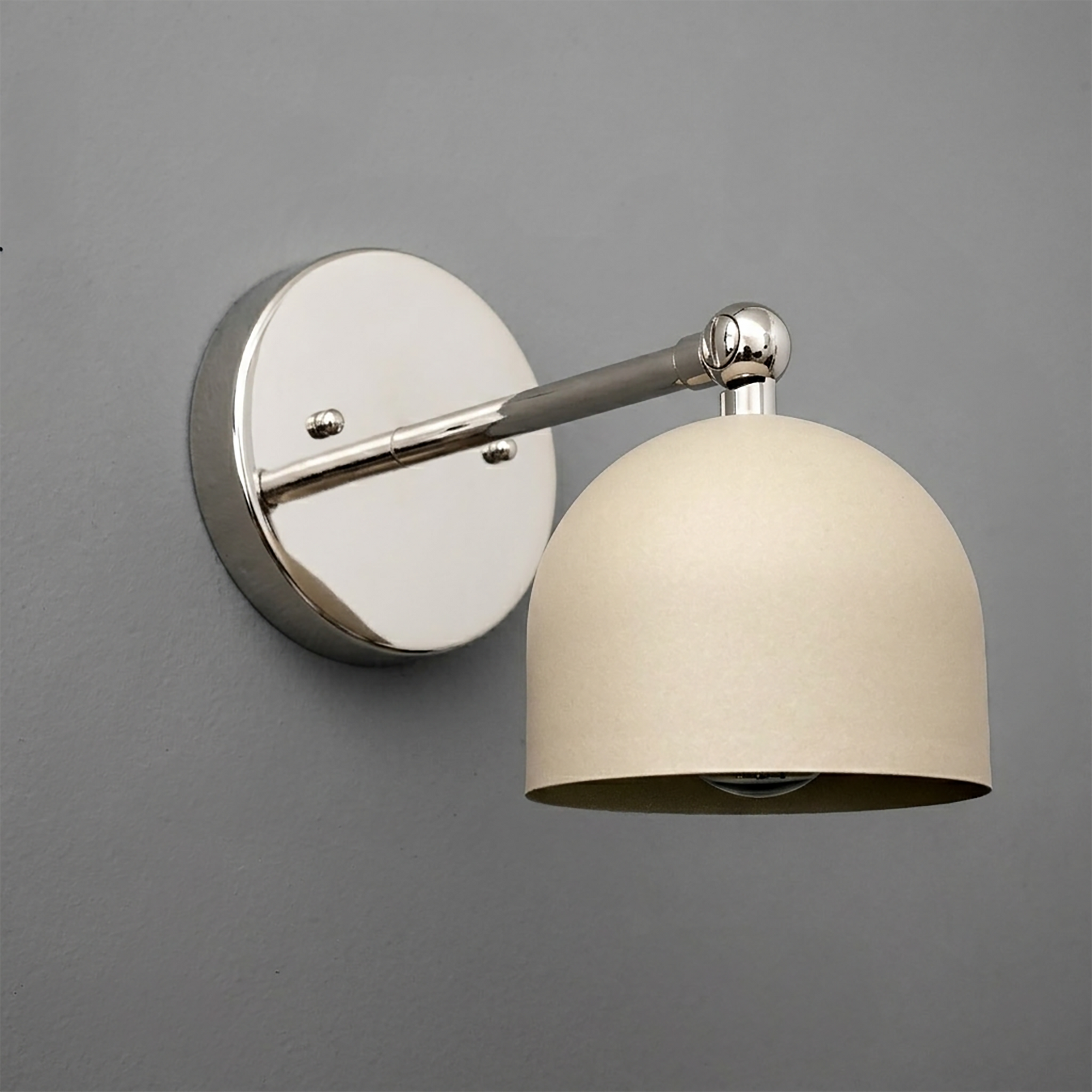 Wall-mounted sconce with polished chrome round base and arm, featuring a matte beige dome-shaped shade. - SCONCE MODEL NO. 5103