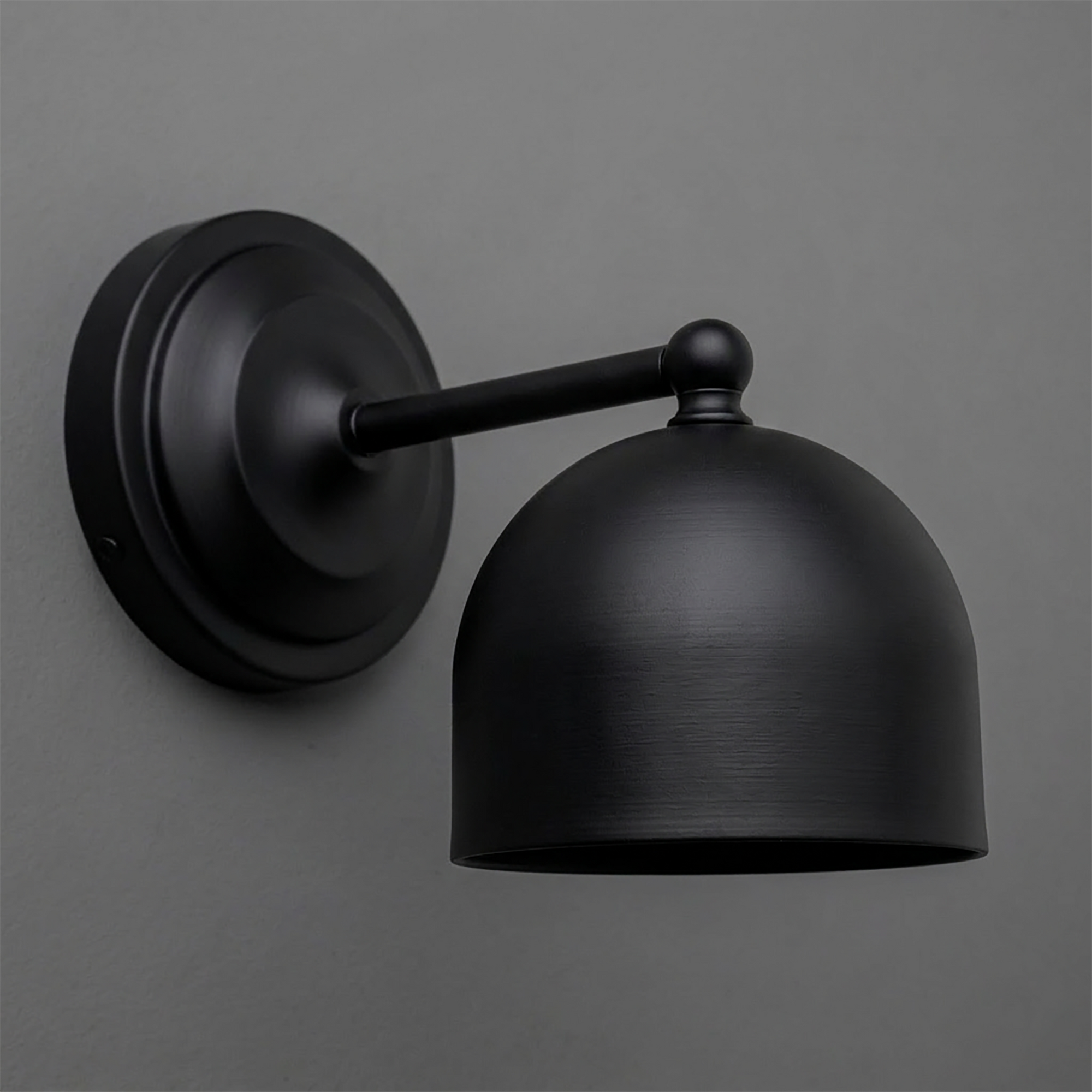 Matte black metal 1-bulb wall sconce with dome-shaped shade and round mounting plate. - SCONCE MODEL NO. 6649