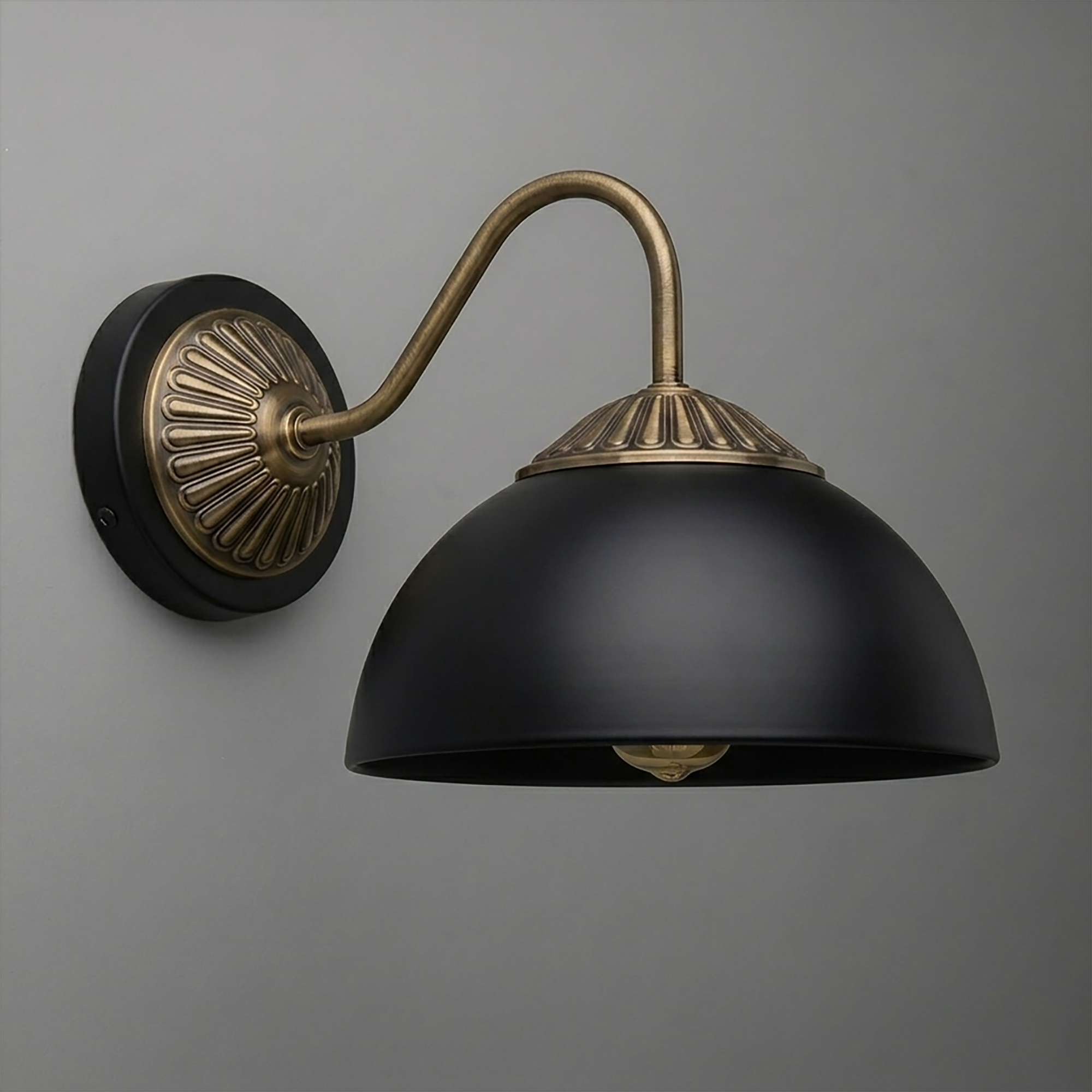 Black dome-shaped metal wall sconce with antique brass curved arm and decorative round backplate. - SCONCE MODEL NO. 9408