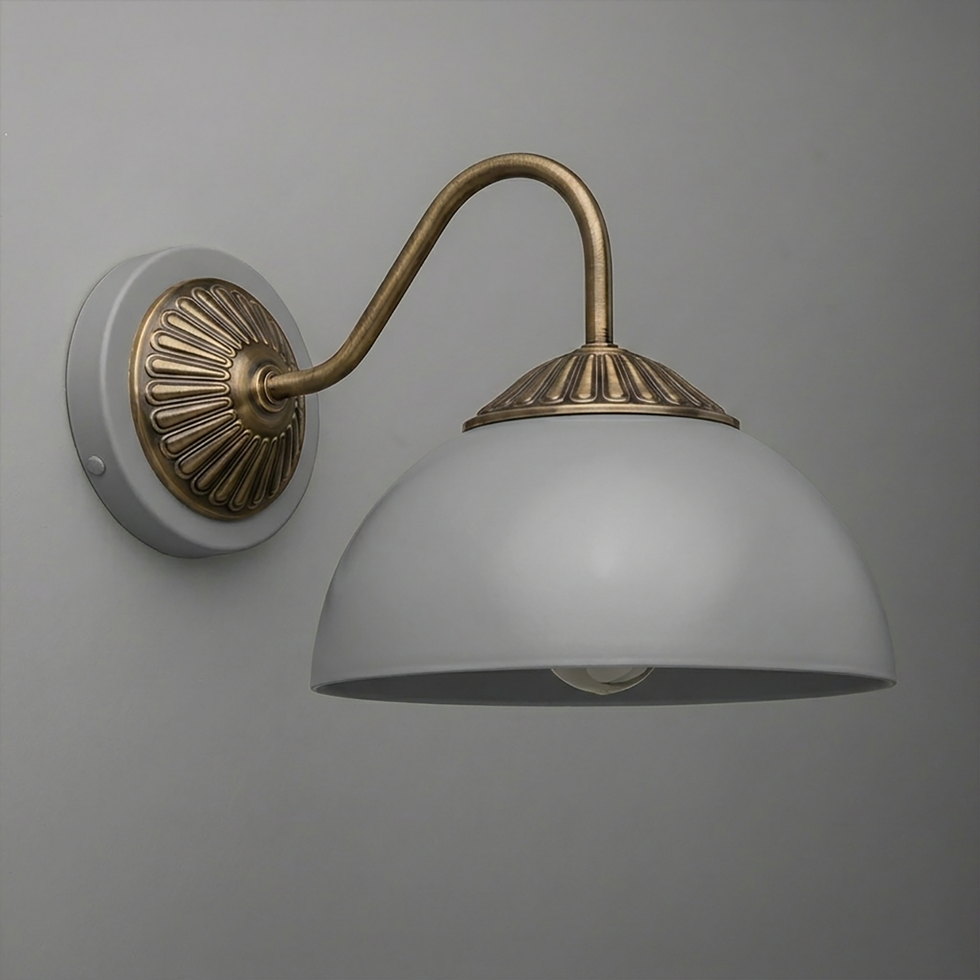 Wall sconce with curved brass arm, fluted brass details, and a matte white dome-shaped shade. - SCONCE MODEL NO. 9408