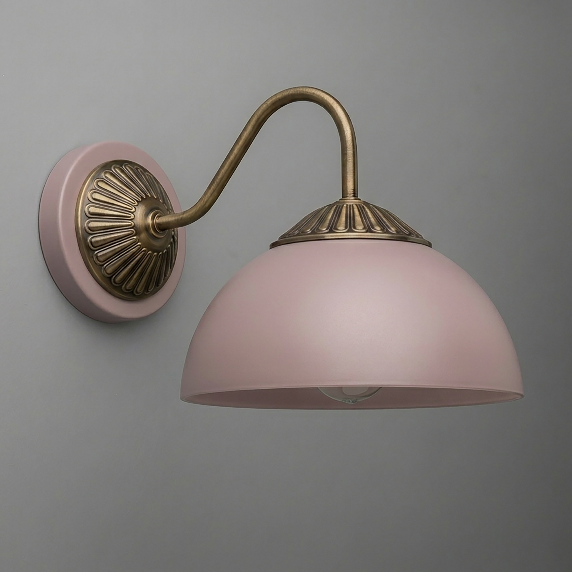 Wall sconce with matte pink dome shade and antique brass curved arm and base plate. - SCONCE MODEL NO. 9408
