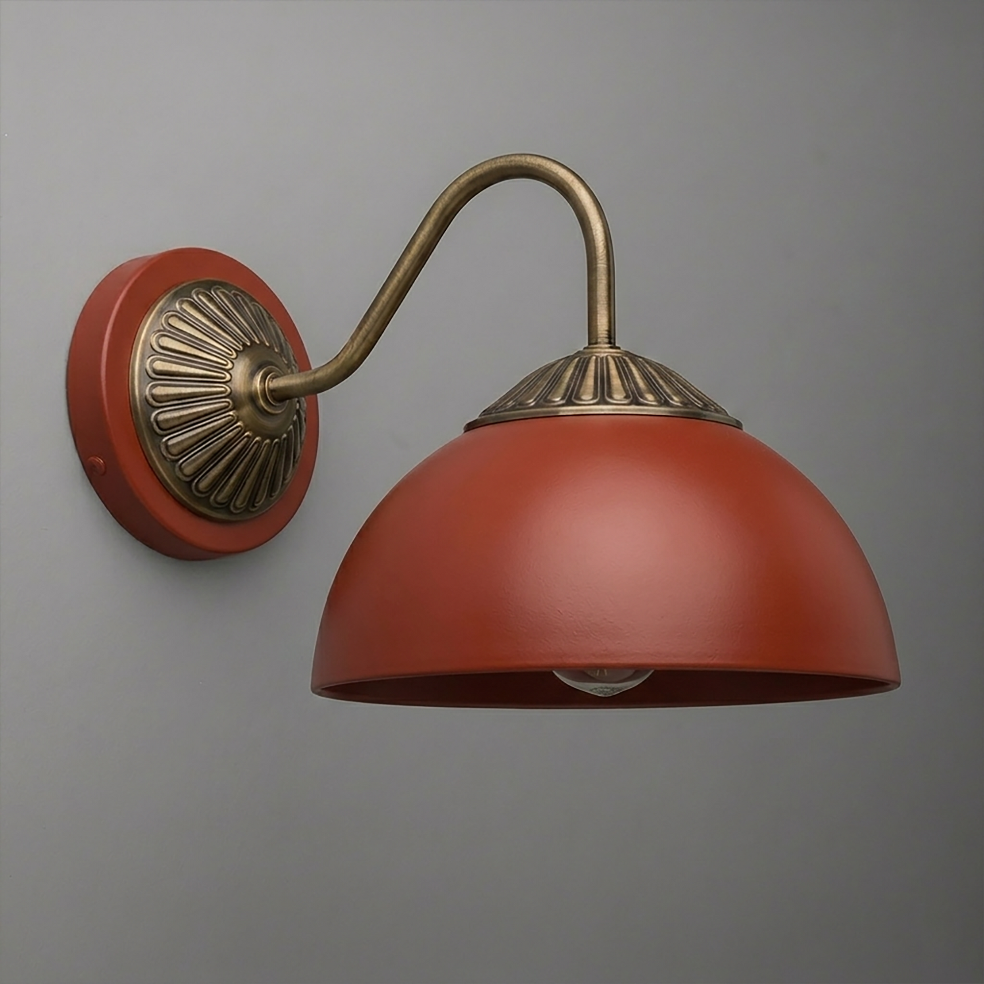 Wall-mounted sconce with curved brass arm and rust-colored dome-shaped metal shade. - SCONCE MODEL NO. 9408