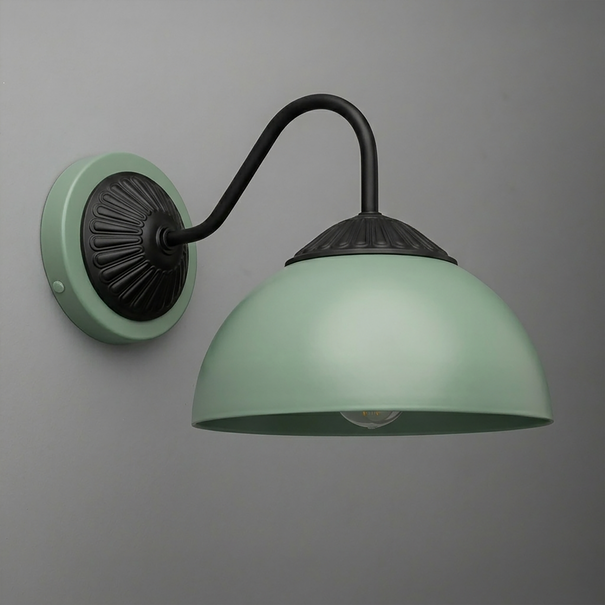 Matte green metal wall sconce with black curved arm and decorative black mounting plate. - SCONCE MODEL NO. 9408