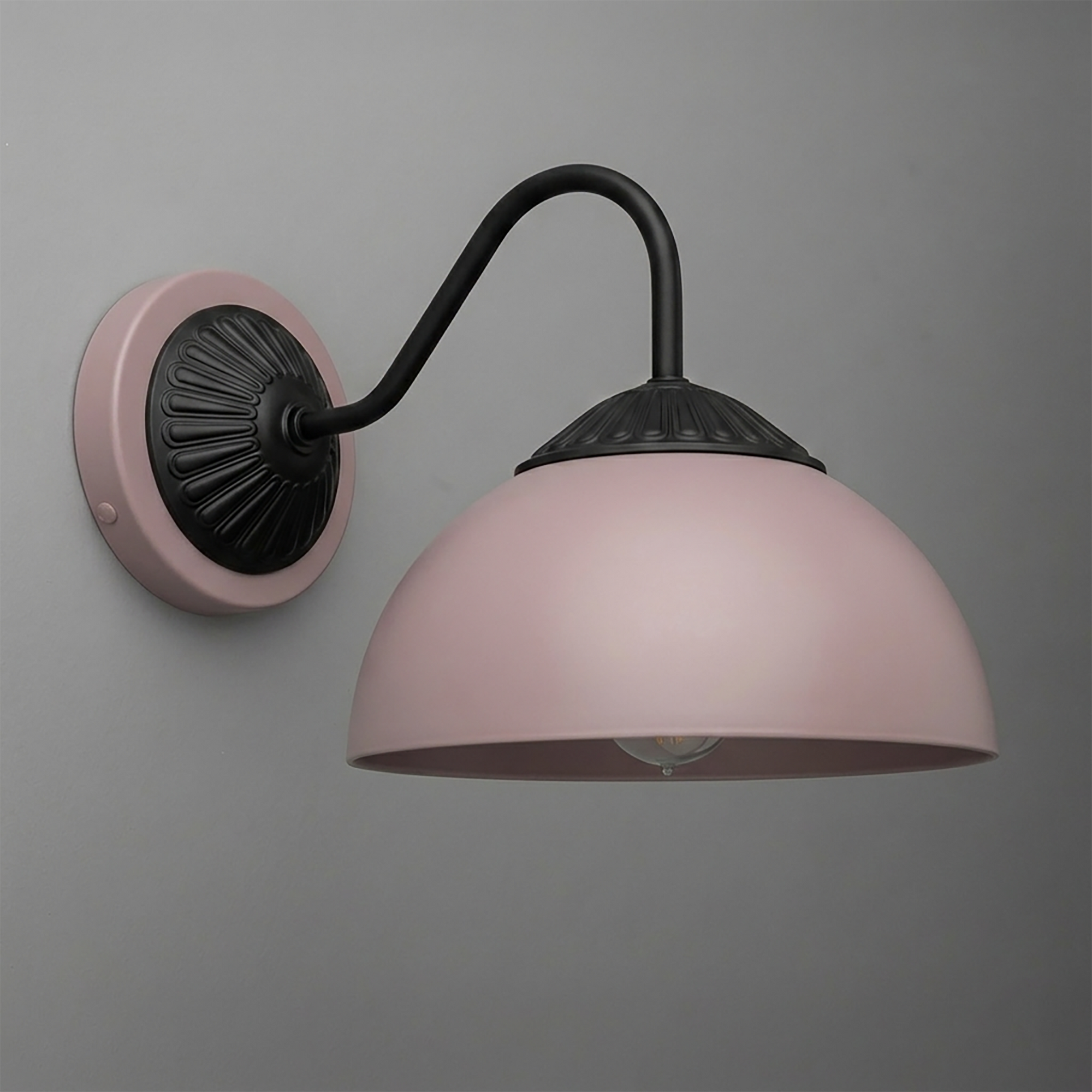 Matte pink dome-shaped metal sconce with black curved arm and decorative black wall plate. - SCONCE MODEL NO. 9408