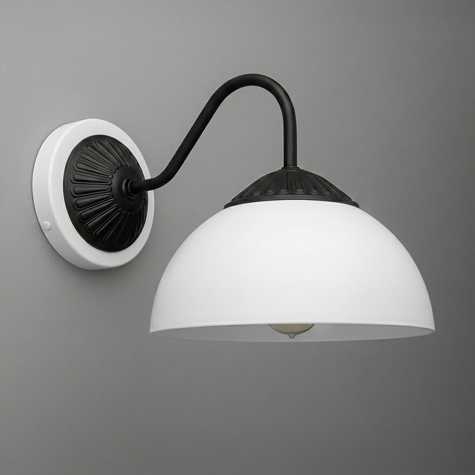 Black metal wall sconce with curved arm and white dome glass shade mounting on a white round base. - SCONCE MODEL NO. 9408