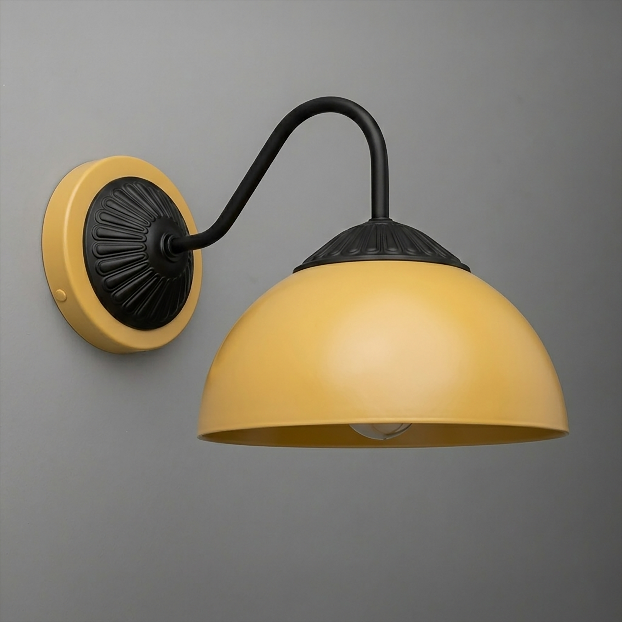 Yellow dome-shaped metal wall sconce with black curved arm and decorative black mounting plate. - SCONCE MODEL NO. 9408