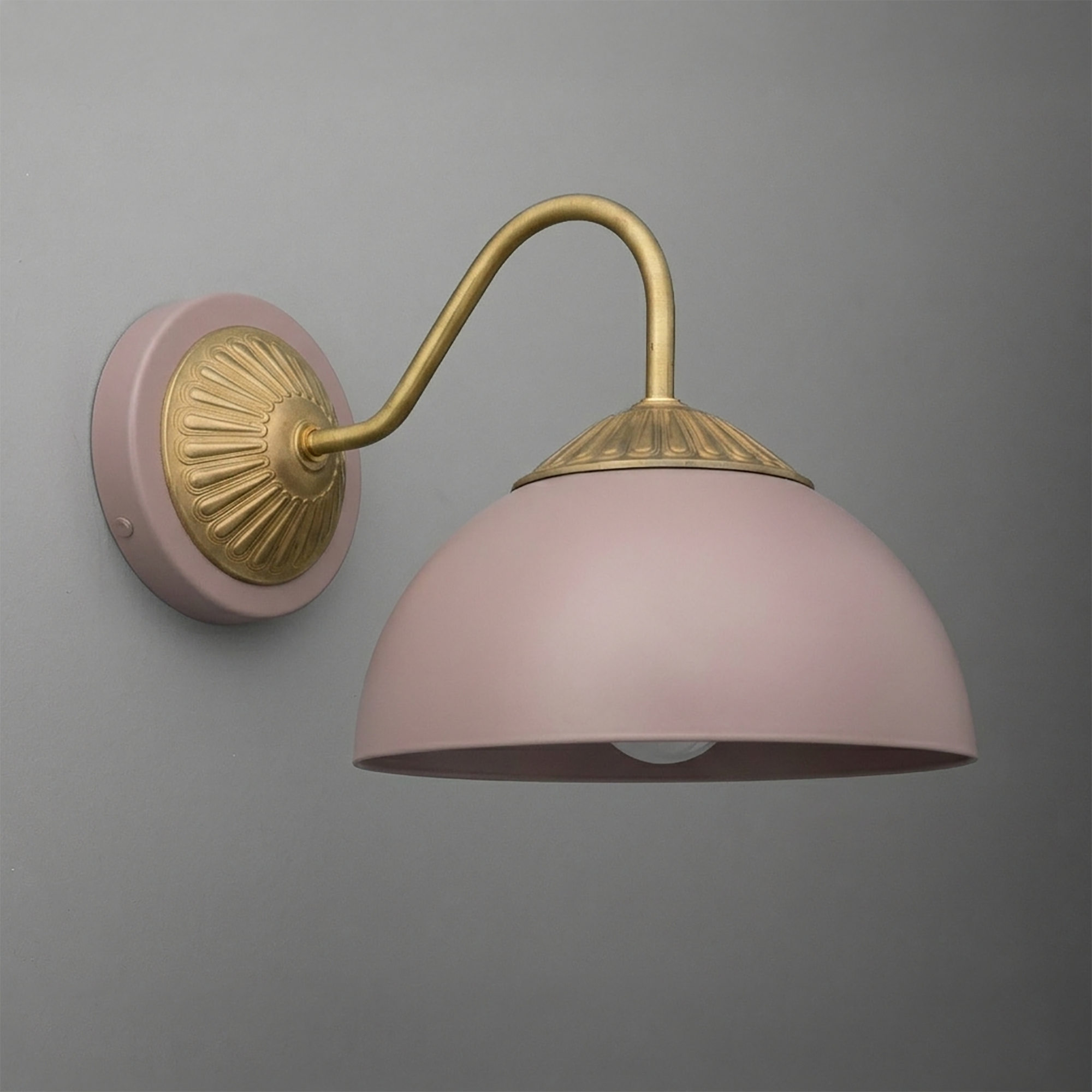 Wall-mounted sconce with matte pink dome shade and curved antique brass arm and base. - SCONCE MODEL NO. 9408