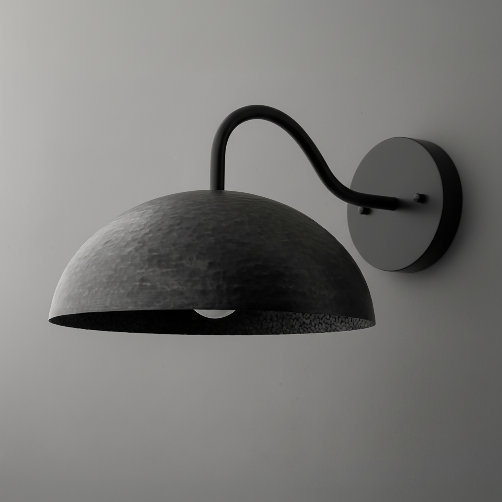 Black metal wall sconce with dome-shaped shade and curved arm mounting on round base. - SCONCE MODEL NO. 9874
