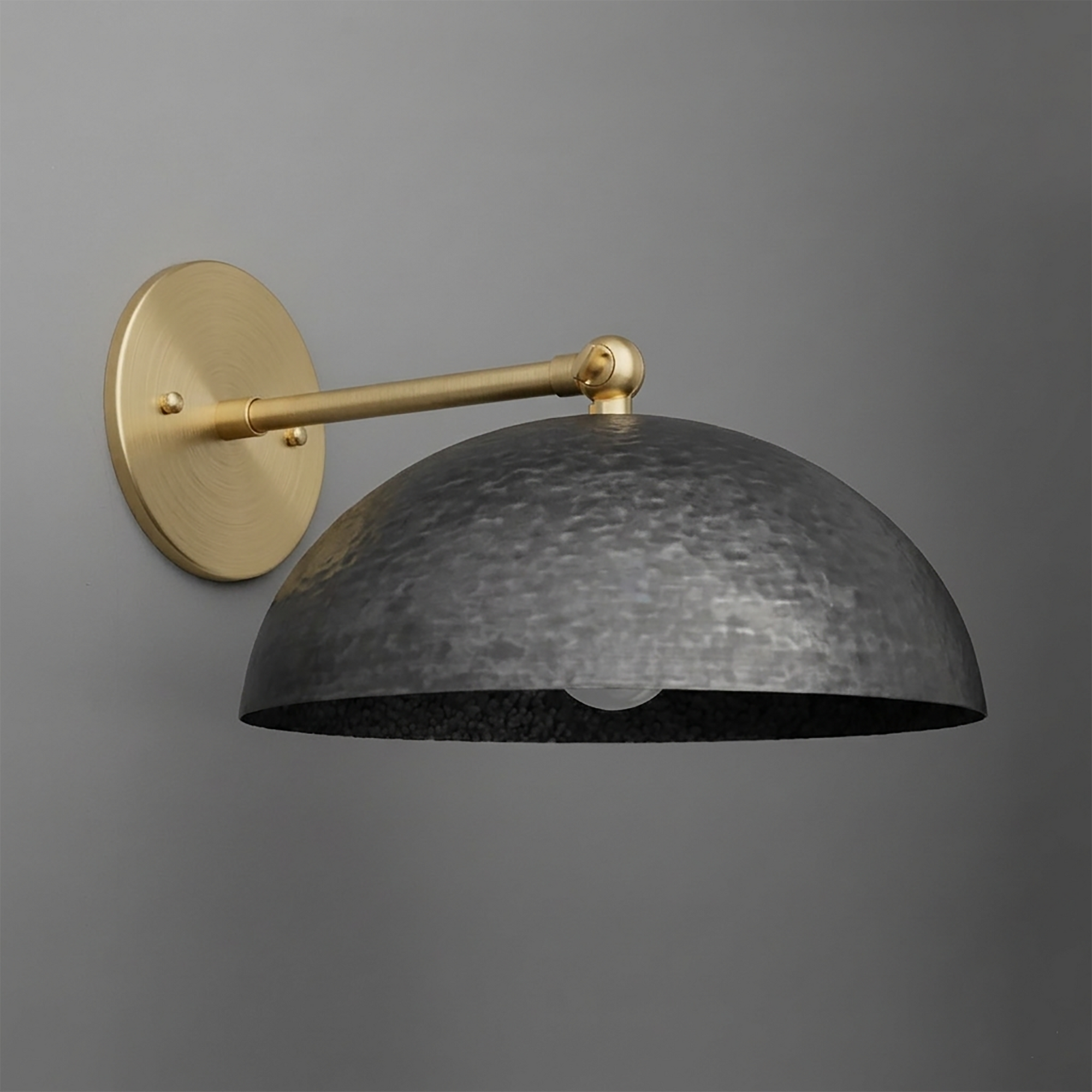 Wall sconce with a hammered black metal dome shade and brass arm and round wall mount. - SCONCE MODEL NO. 3164