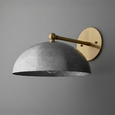 Industrial-style wall sconce with a hammered metal dome shade and brass arm and mounting plate. - SCONCE MODEL NO. 3164