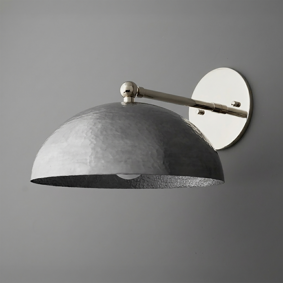 Industrial-style 1-bulb wall sconce with a hammered metal dome shade and polished nickel arm and round wall plate. - SCONCE MODEL NO. 3164