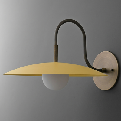 Wall-mounted sconce with a matte mustard yellow conical metal shade and frosted white globe bulb, supported by a curved dark - SCONCE MODEL NO. 9171