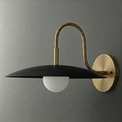 Wall sconce with matte black wide disc shade and frosted globe bulb, brass curved arm and round base plate. - SCONCE MODEL NO. 9171