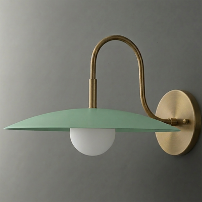 Wall sconce with a matte green flat disc shade, matte white globe bulb, and brushed brass curved arm and round wall mount. - SCONCE MODEL NO. 9171