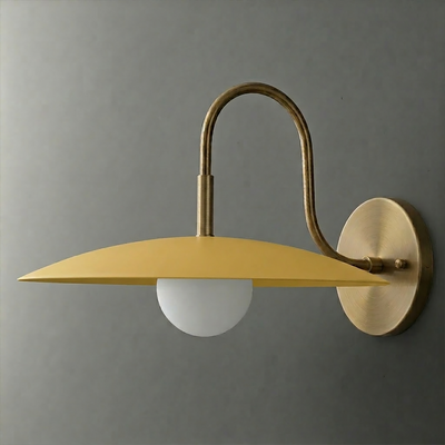 Mustard yellow metal shade sconce with frosted globe bulb and brushed brass curved arm and round wall mount. - SCONCE MODEL NO. 9171