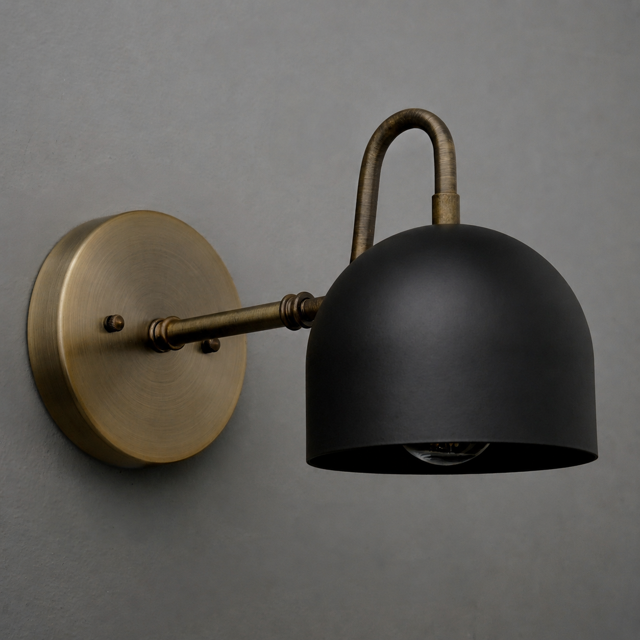 Wall sconce with matte black dome shade and antique brass arm and round base. - SCONCE MODEL NO. 3628