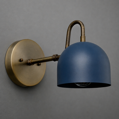 Wall-mounted sconce with an antique brass arm and base, featuring a smooth matte navy blue dome-shaped metal shade. - SCONCE MODEL NO. 3628