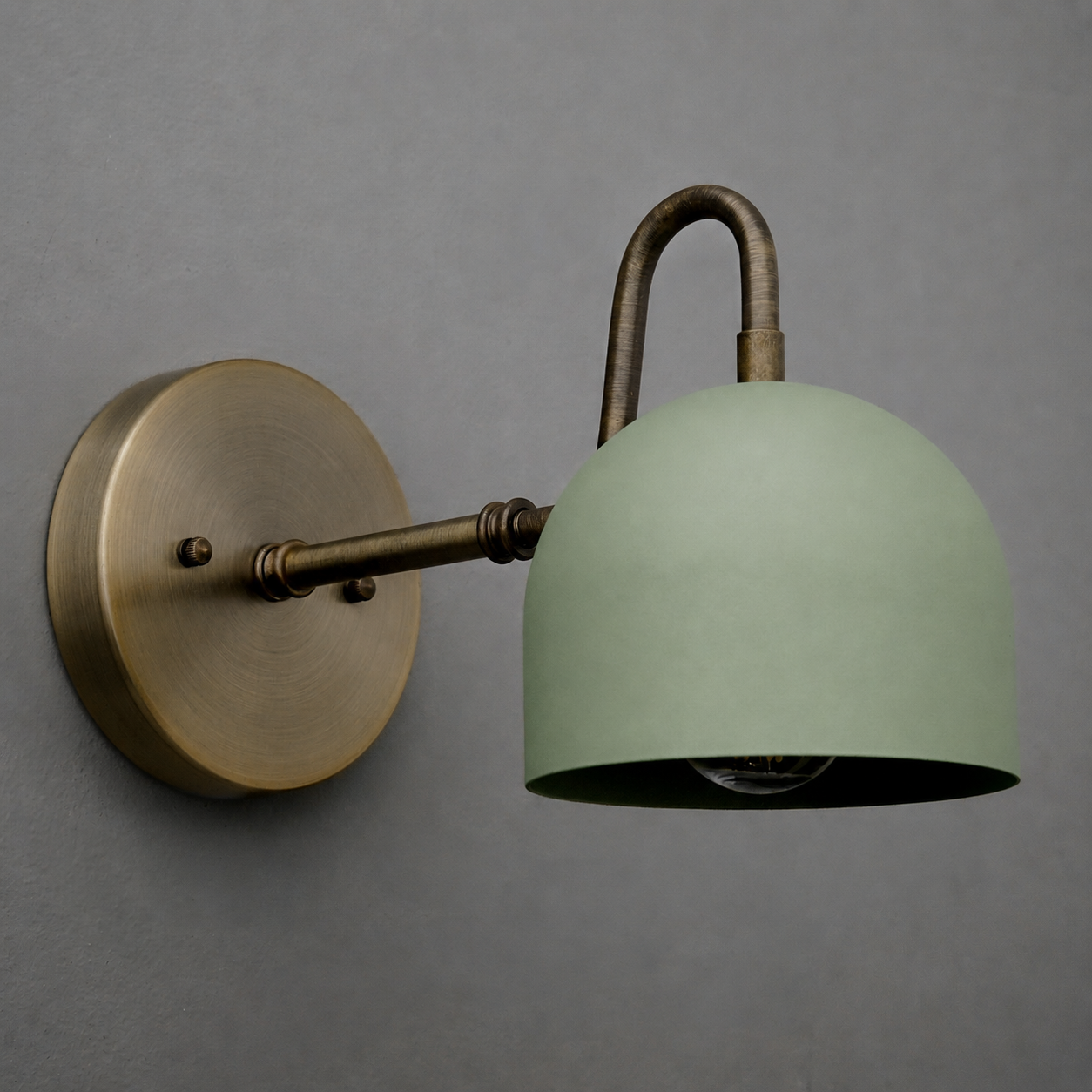Wall-mounted single-bulb sconce with matte green dome shade and antique brass arm and base. - SCONCE MODEL NO. 3628