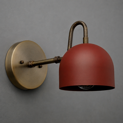 Wall-mounted sconce with a matte red dome shade and antique brass round base and arm. - SCONCE MODEL NO. 3628