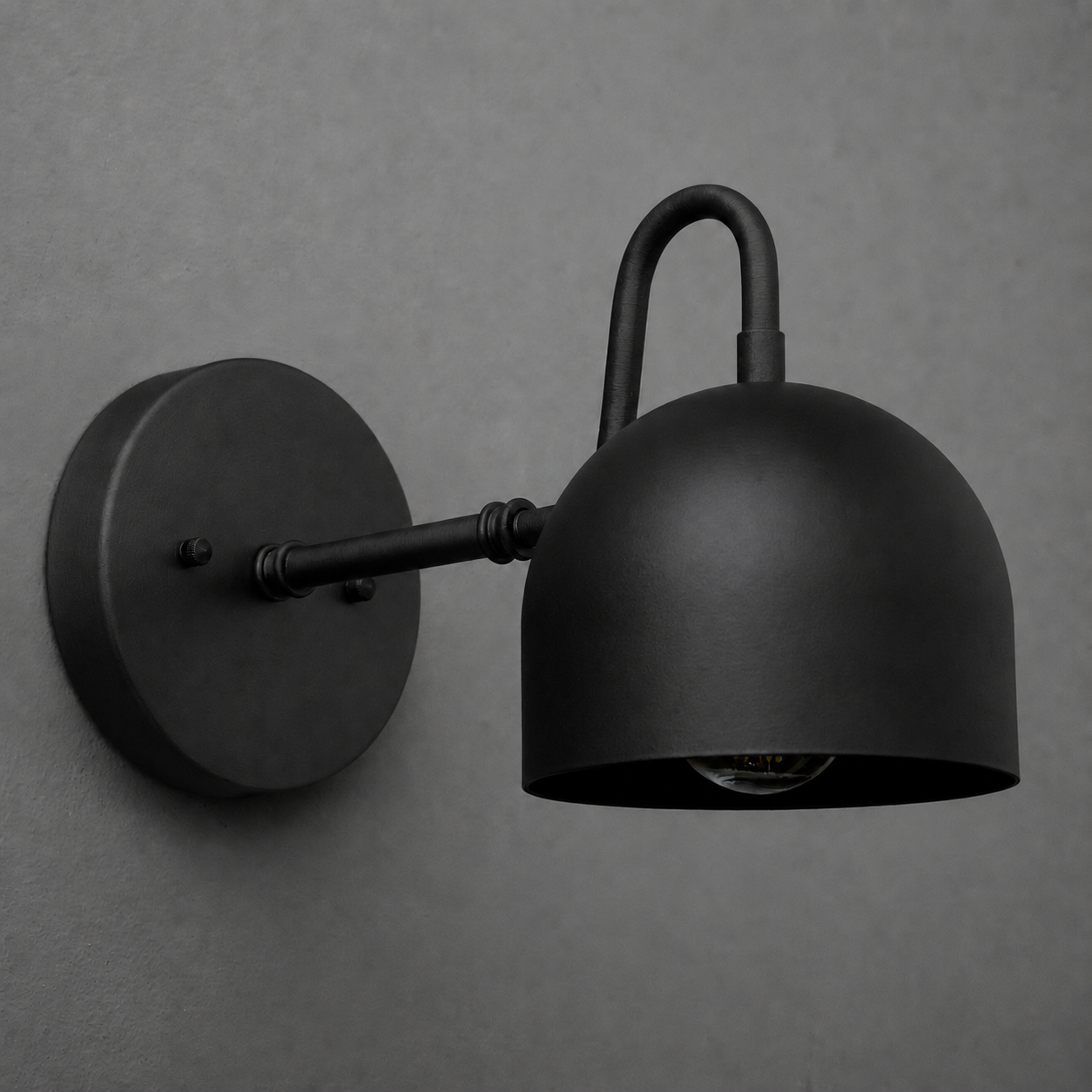 Matte black metal wall sconce with dome-shaped shade and round mounting base. - SCONCE MODEL NO. 3628