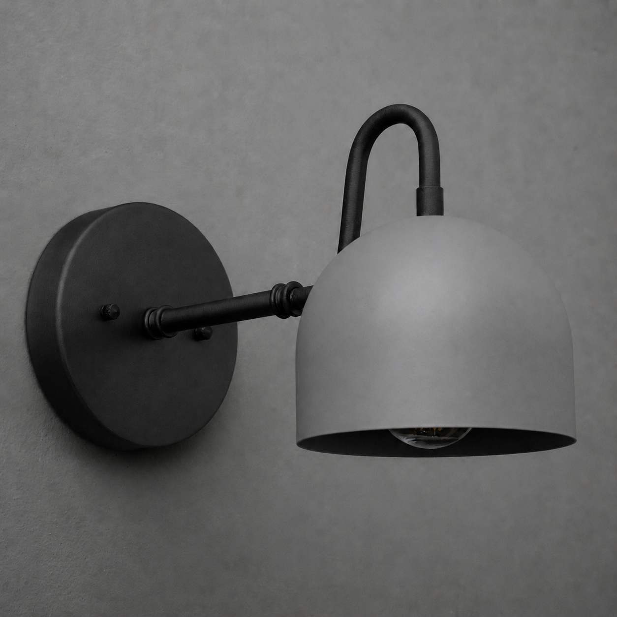 Matte black metal wall sconce with a curved arm and a dome-shaped shade from the Deep Ball Collection. - SCONCE MODEL NO. 3628