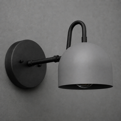 Matte black metal wall sconce with a curved arm and a dome-shaped shade from the Deep Ball Collection. - SCONCE MODEL NO. 3628