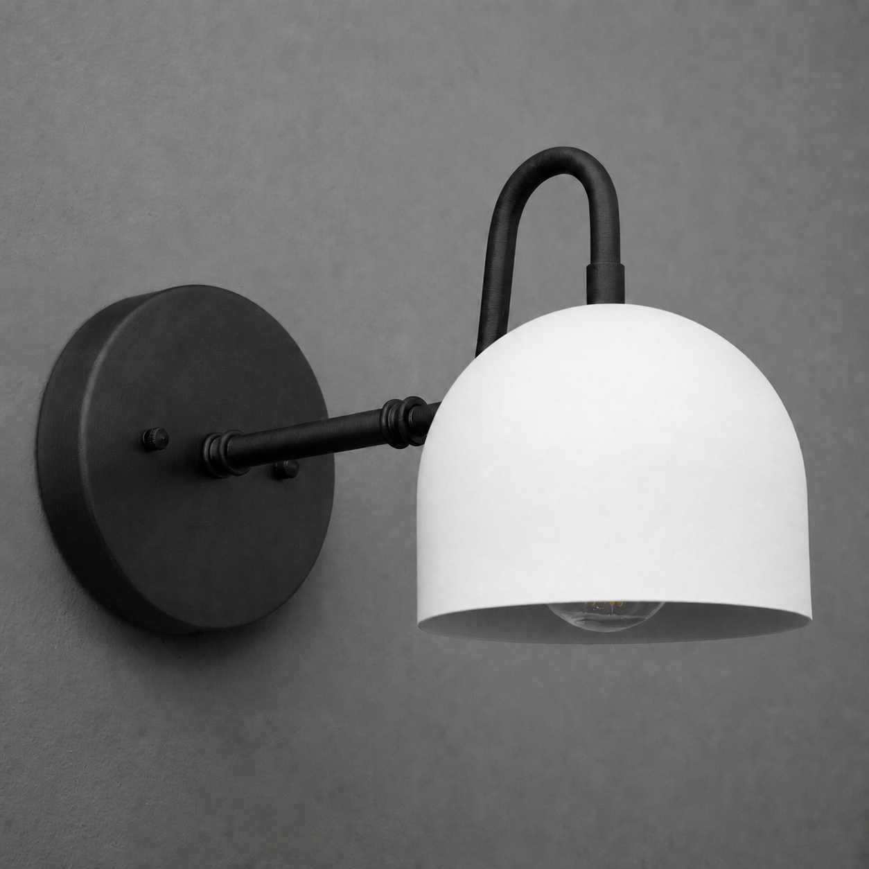Matte black metal wall sconce with a curved arm and white dome-shaped shade. - SCONCE MODEL NO. 3628