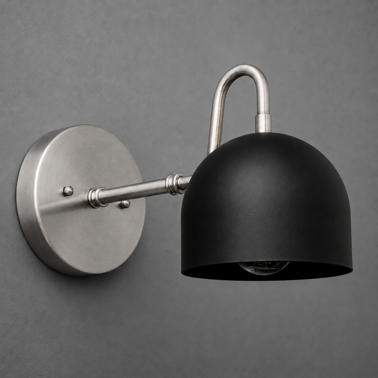 Matte black dome-shaped metal shade with brushed nickel arm and round wall mount sconce. - SCONCE MODEL NO. 3628