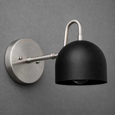 Matte black dome-shaped metal shade with brushed nickel arm and round wall mount sconce. - SCONCE MODEL NO. 3628