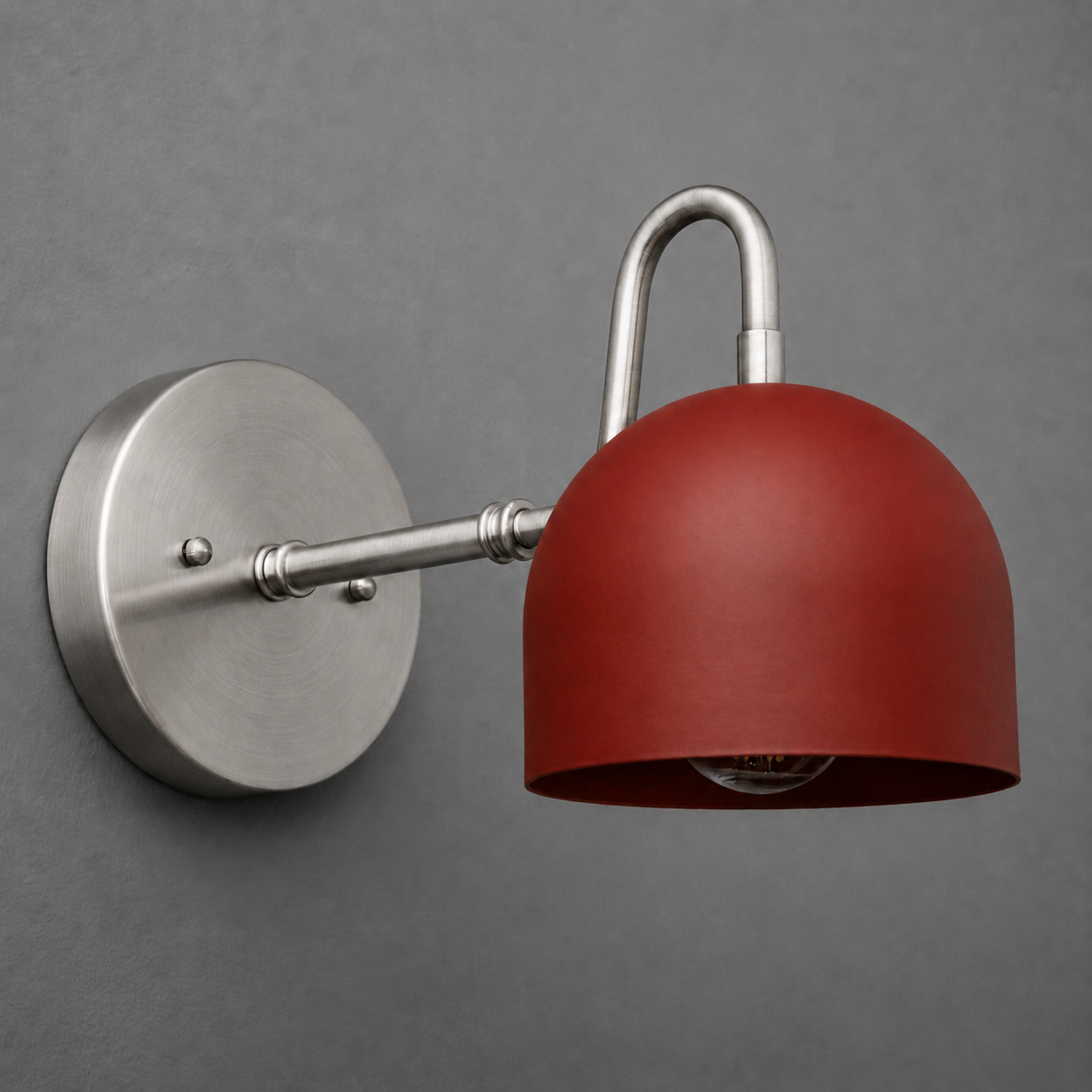 Wall-mounted sconce with brushed nickel base and arm, featuring a matte red dome-shaped metal shade. - SCONCE MODEL NO. 3628