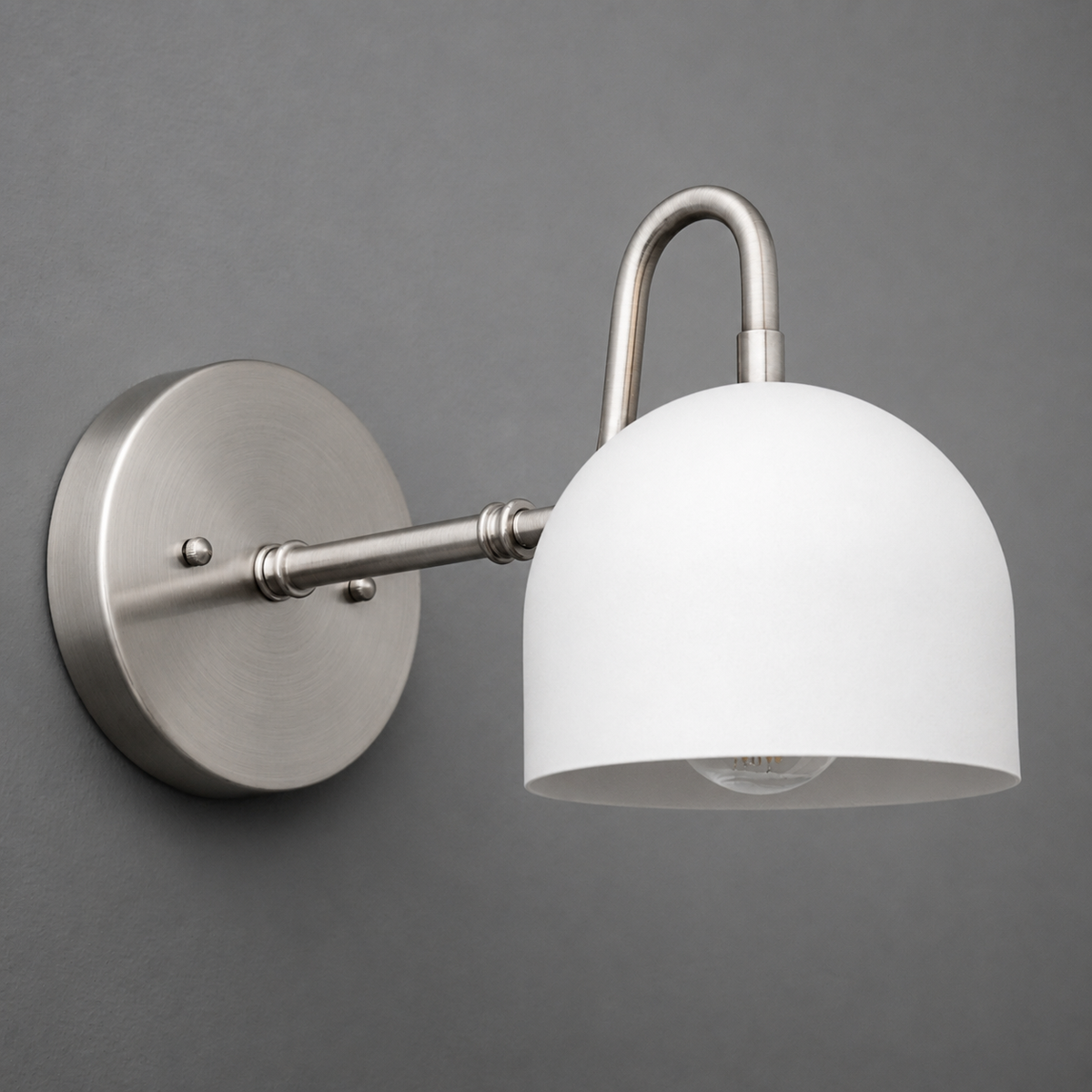 Brushed nickel wall sconce with a round backplate and a white dome-shaped glass shade. - SCONCE MODEL NO. 3628