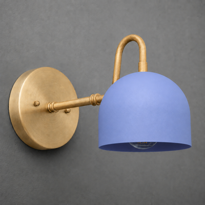 Wall-mounted sconce with matte brass arm and round base, featuring a smooth blue dome-shaped shade. - SCONCE MODEL NO. 3628