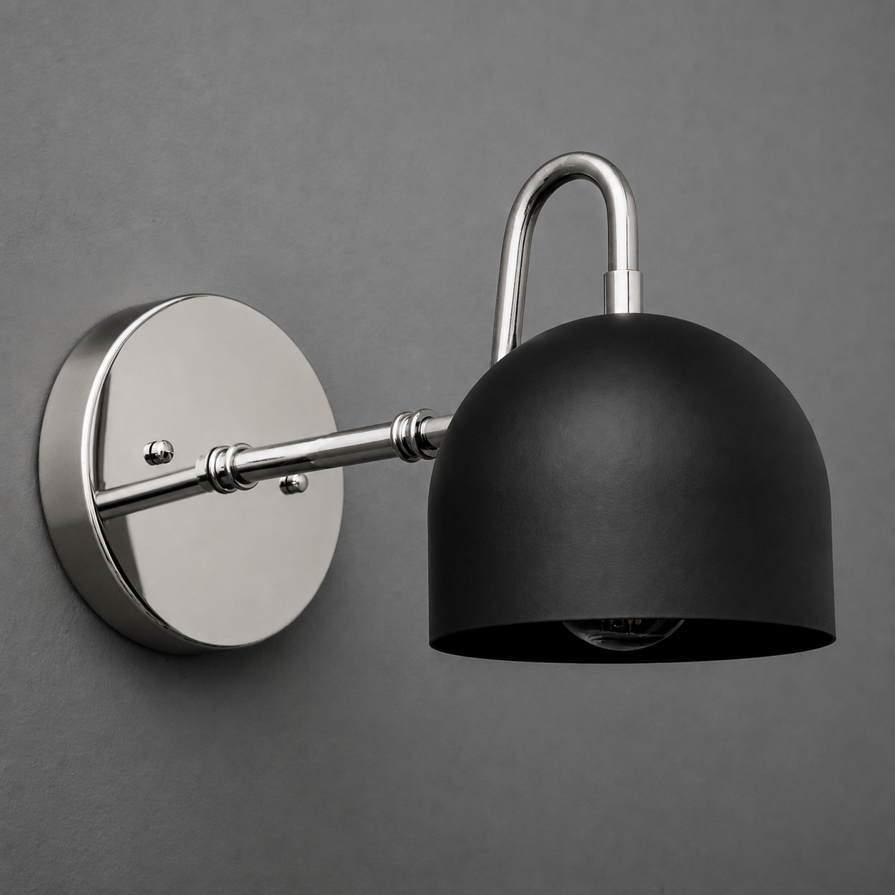 Matte black dome-shaped metal sconce with brushed nickel round wall mount and arm. - SCONCE MODEL NO. 3628