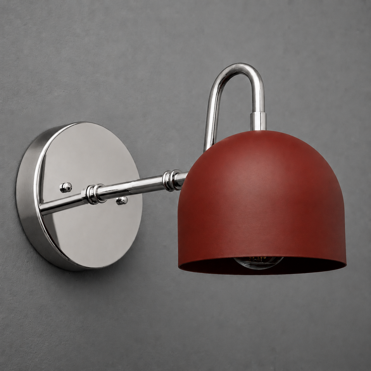 Wall-mounted sconce with a matte red dome shade and polished silver metal arm and round base. - SCONCE MODEL NO. 3628