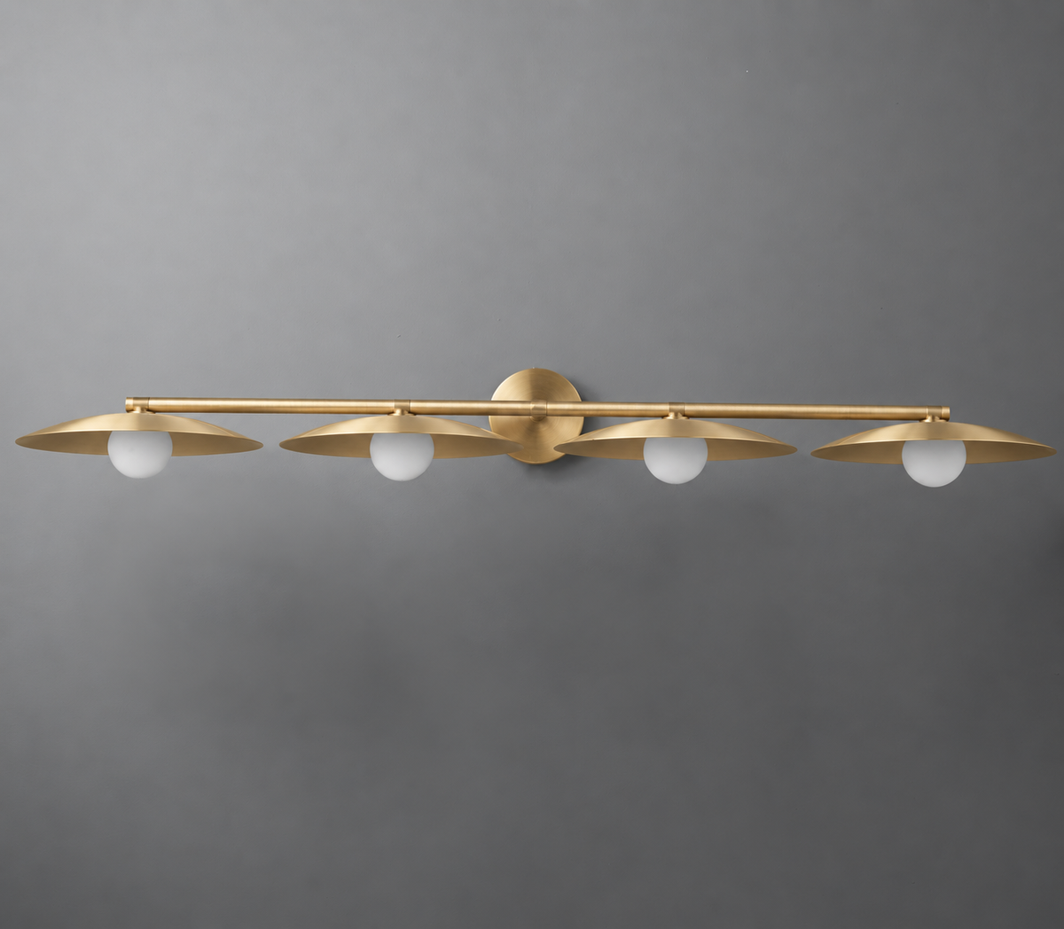Brushed gold metal vanity light with four evenly spaced round bulbs and circular mounting plate. - VANITY LIGHT MODEL NO. 1152