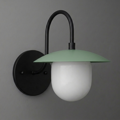 Matte black metal wall sconce with curved arm and green wide flat shade over frosted white globe bulb cover. - SCONCE MODEL NO. 7191