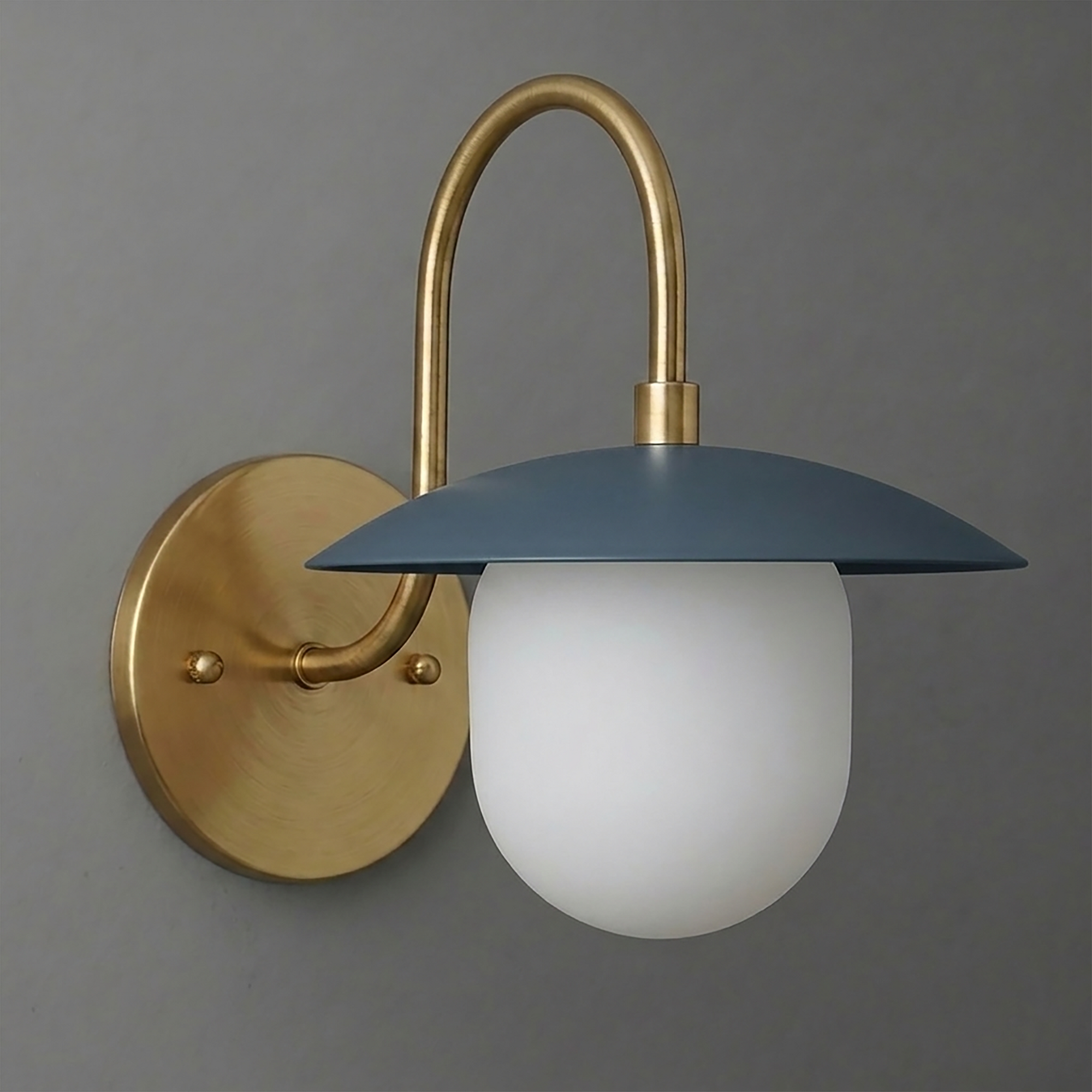 Brushed brass 1-bulb wall sconce with curved arm and matte blue metal shade over frosted white glass globe. - SCONCE MODEL NO. 7191
