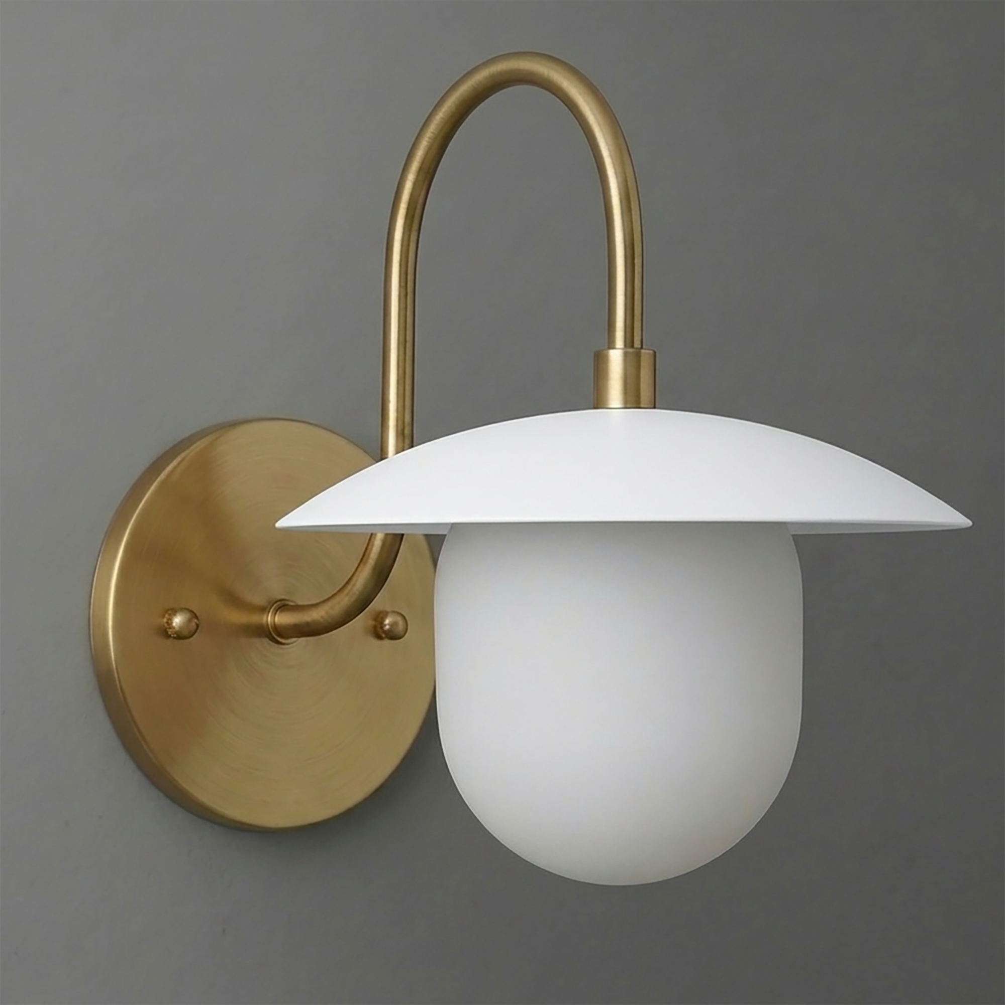 Brushed brass wall sconce with curved arm and white frosted glass dome shade. - SCONCE MODEL NO. 7191