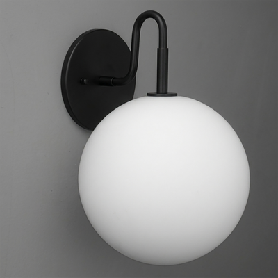 Matte black metal wall sconce with a smooth white frosted glass globe shade and curved arm. - SCONCE MODEL NO. 0478