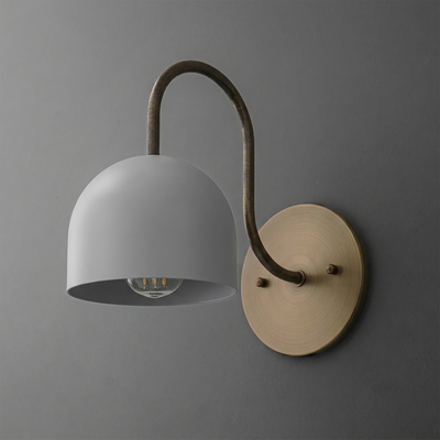 Wall-mounted sconce with a matte gray dome shade and curved bronze arm on a round brass base plate. - SCONCE MODEL NO. 6308