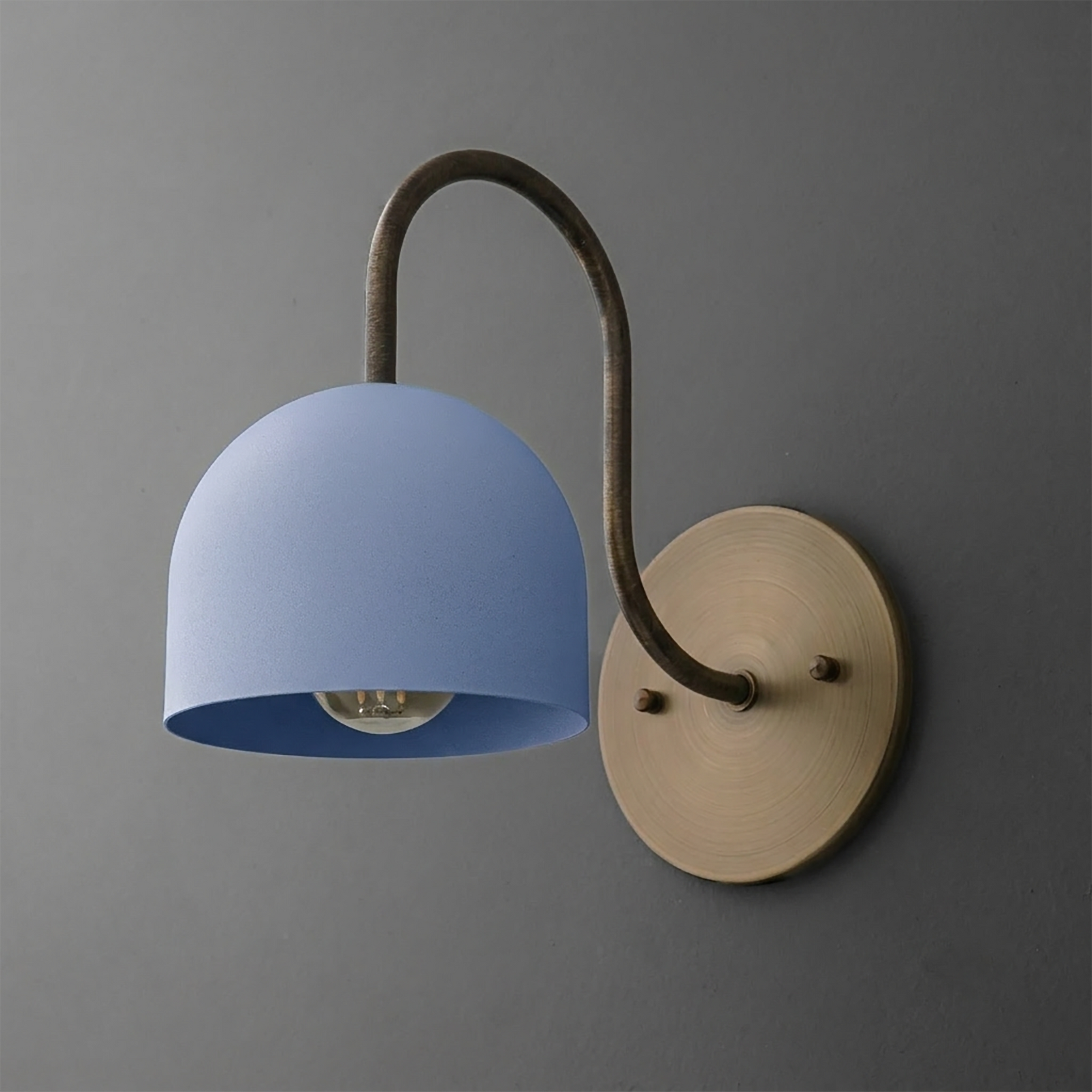 Wall sconce with matte blue dome-shaped metal shade and curved dark bronze arm on round brass base. - SCONCE MODEL NO. 6308