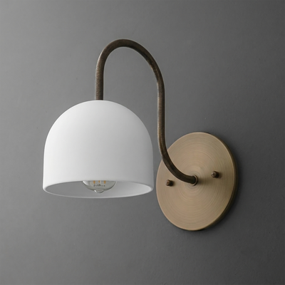 Wall sconce with matte white dome shade and curved dark bronze arm mounted on round brushed brass base. - SCONCE MODEL NO. 6308