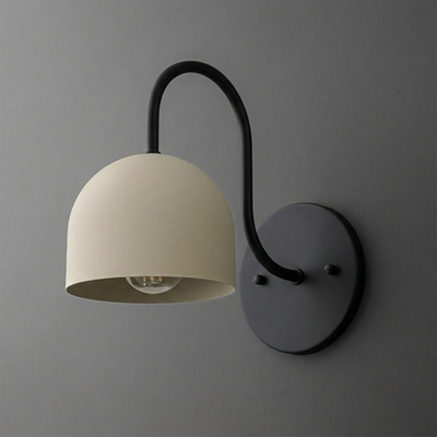 Matte black metal wall sconce with curved arm supporting a cream-colored dome shade and exposed bulb. - SCONCE MODEL NO. 6308