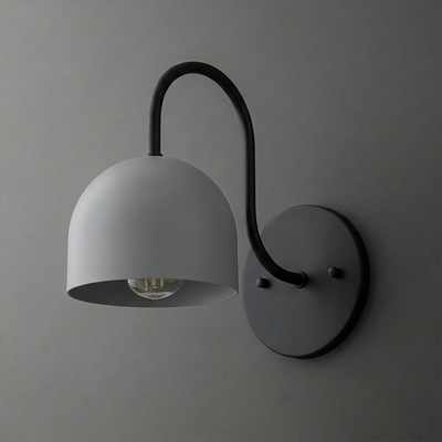 Matte black metal wall sconce with curved arm and dome-shaped shade over exposed bulb. - SCONCE MODEL NO. 6308