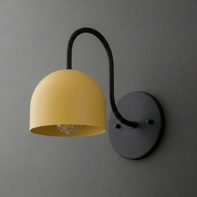 Wall-mounted sconce with matte black metal arm and round base, featuring a smooth, dome-shaped yellow shade. - SCONCE MODEL NO. 6308