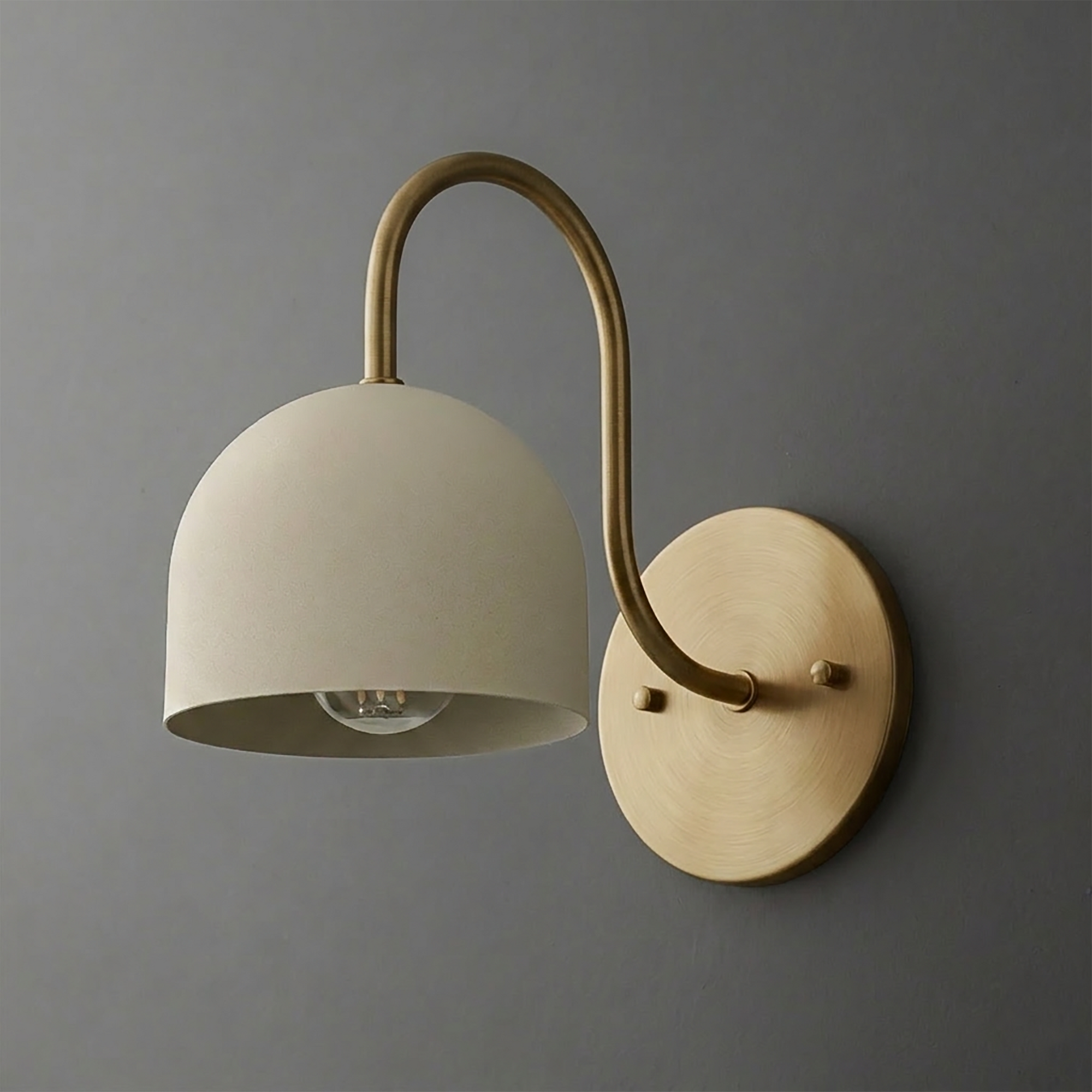 Wall-mounted sconce with a curved brass arm and matte white dome-shaped shade. - SCONCE MODEL NO. 6308