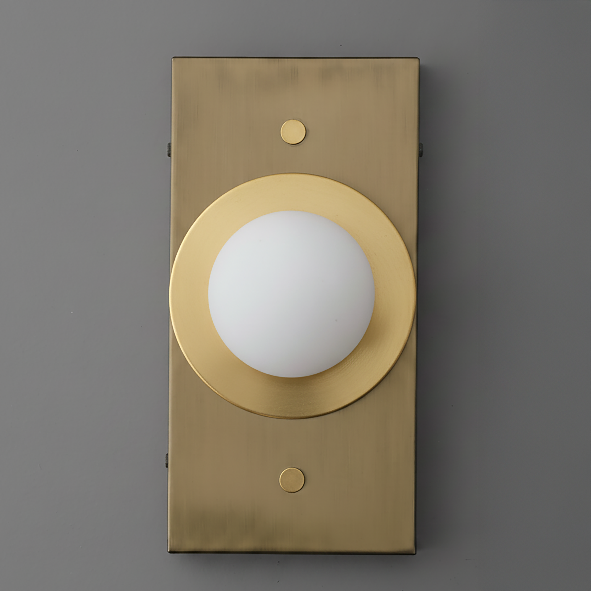 Minimalist antique brass wall sconce with round white globe light and rectangular backplate. - SCONCE MODEL NO. 4474